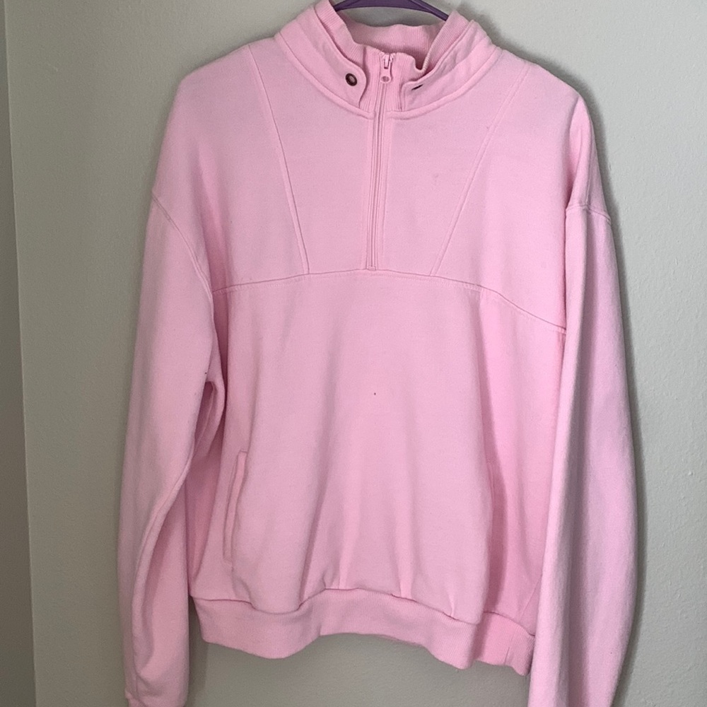 Soft pink sweatshirt with zip up neck